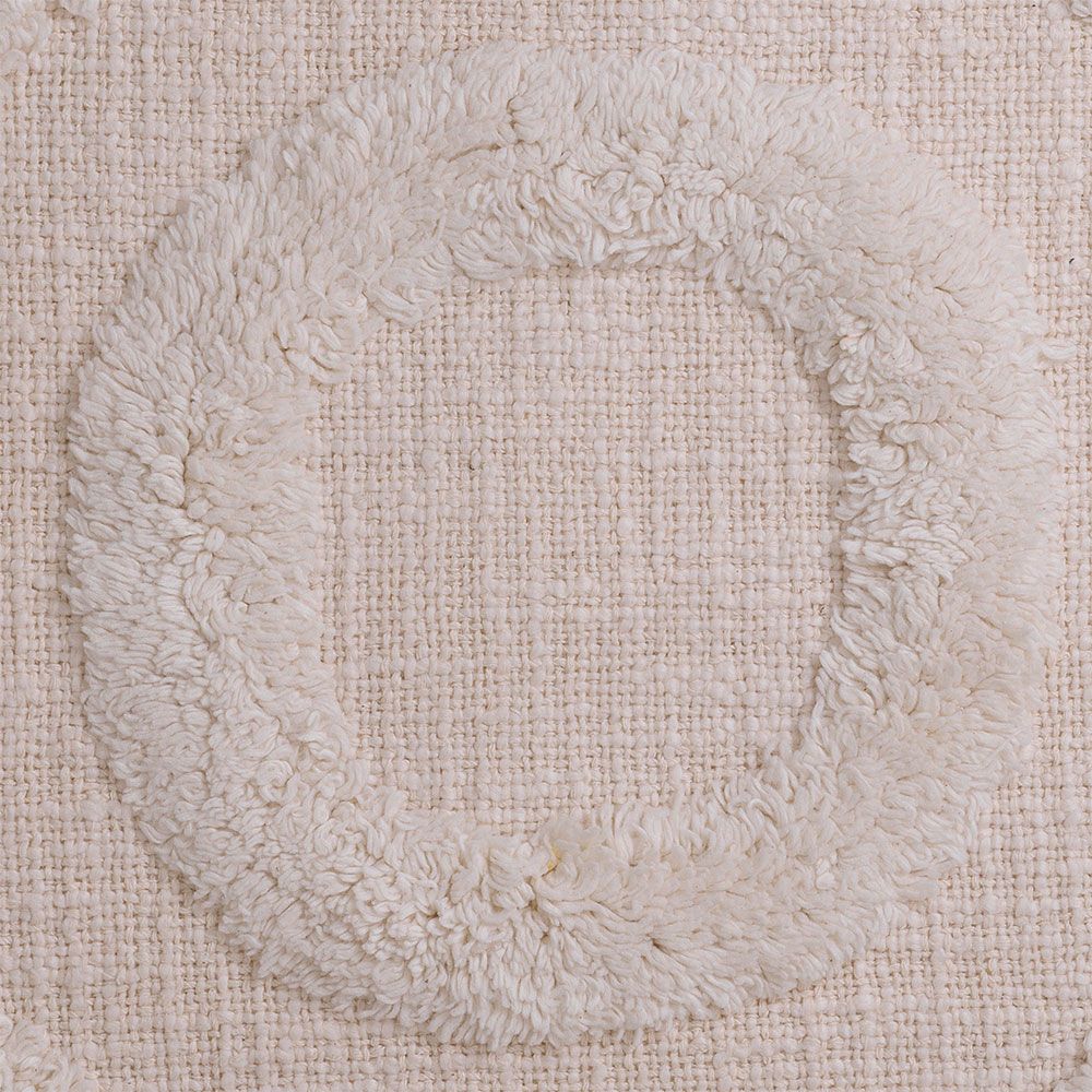 Cosy cotton cushion with tufted circular design