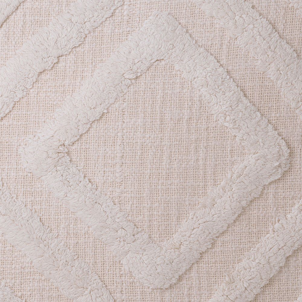 Gorgeous geometric patterned cushion with tufted wool details