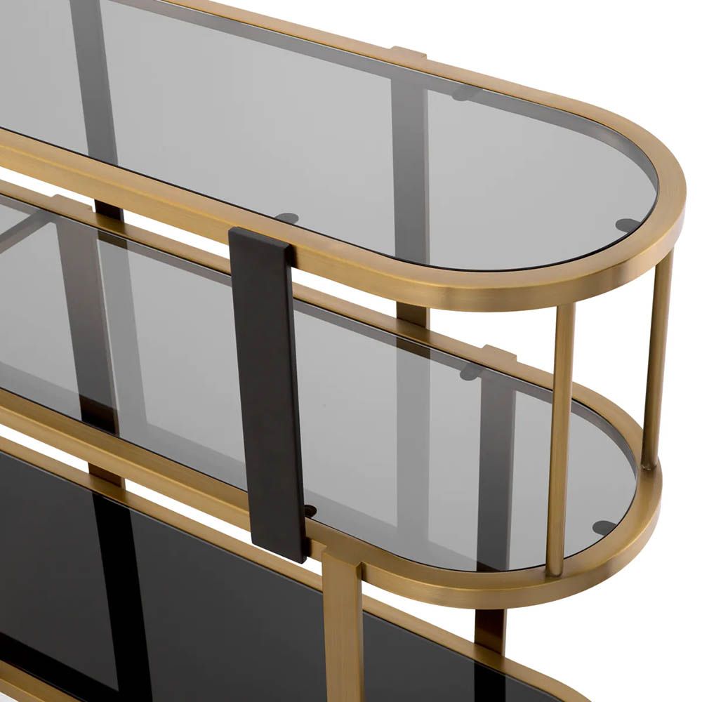 Brass display cabinet with rounded form and glass accents