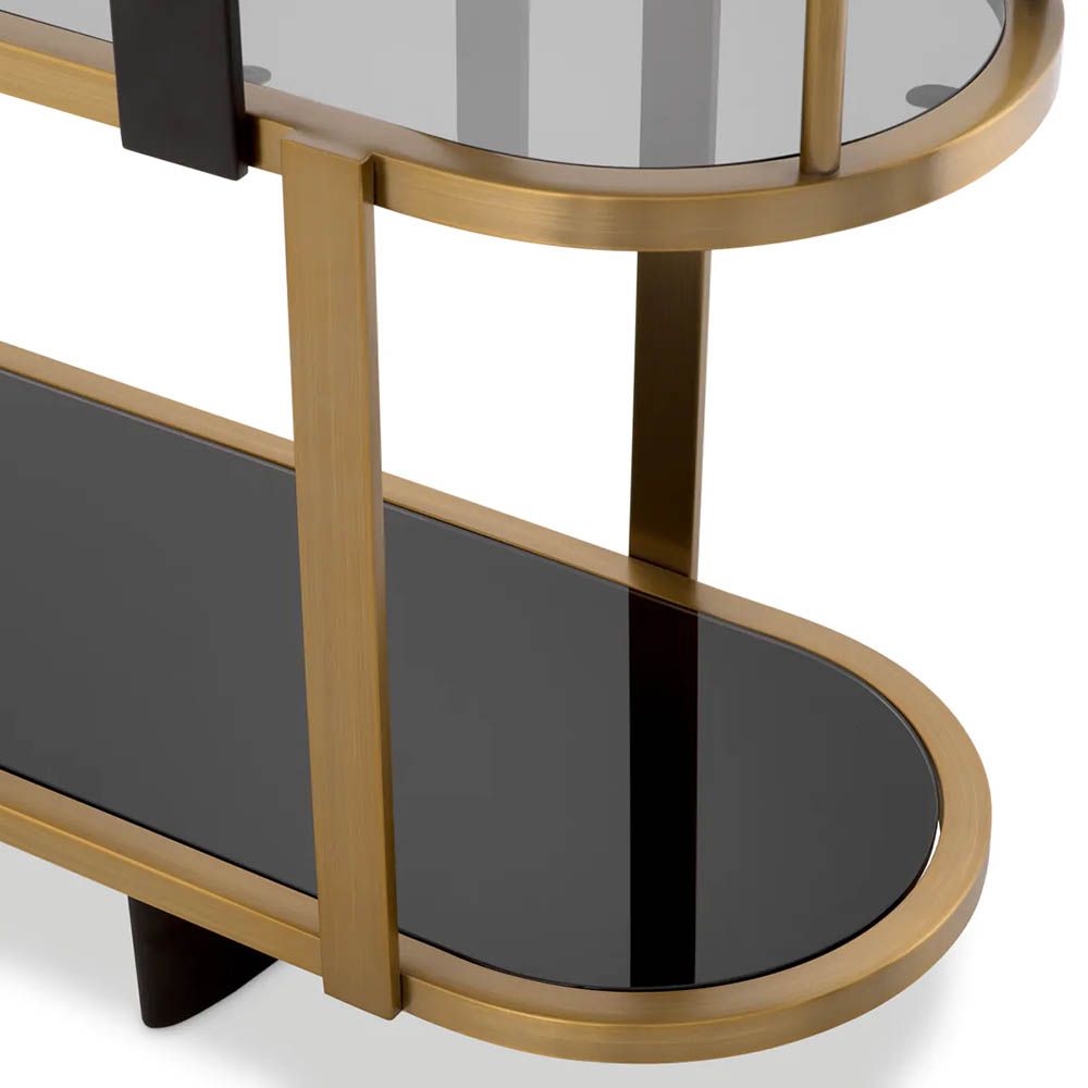 Brass display cabinet with rounded form and glass accents