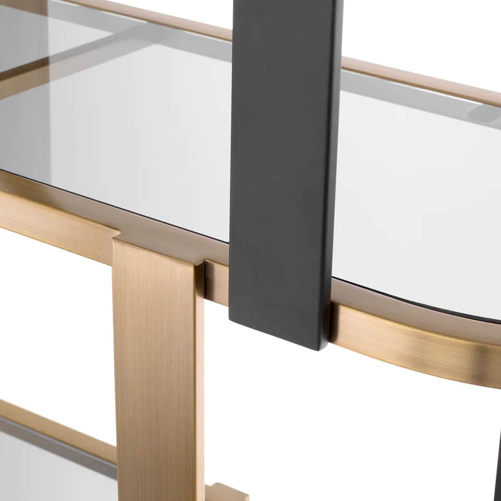 Sophisticated round display cabinet with shelving finished in brass