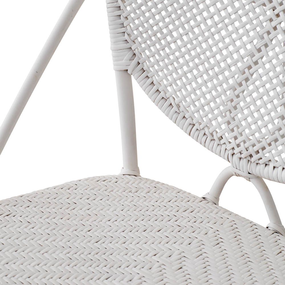 Intricate design rattan dining chair in white finish