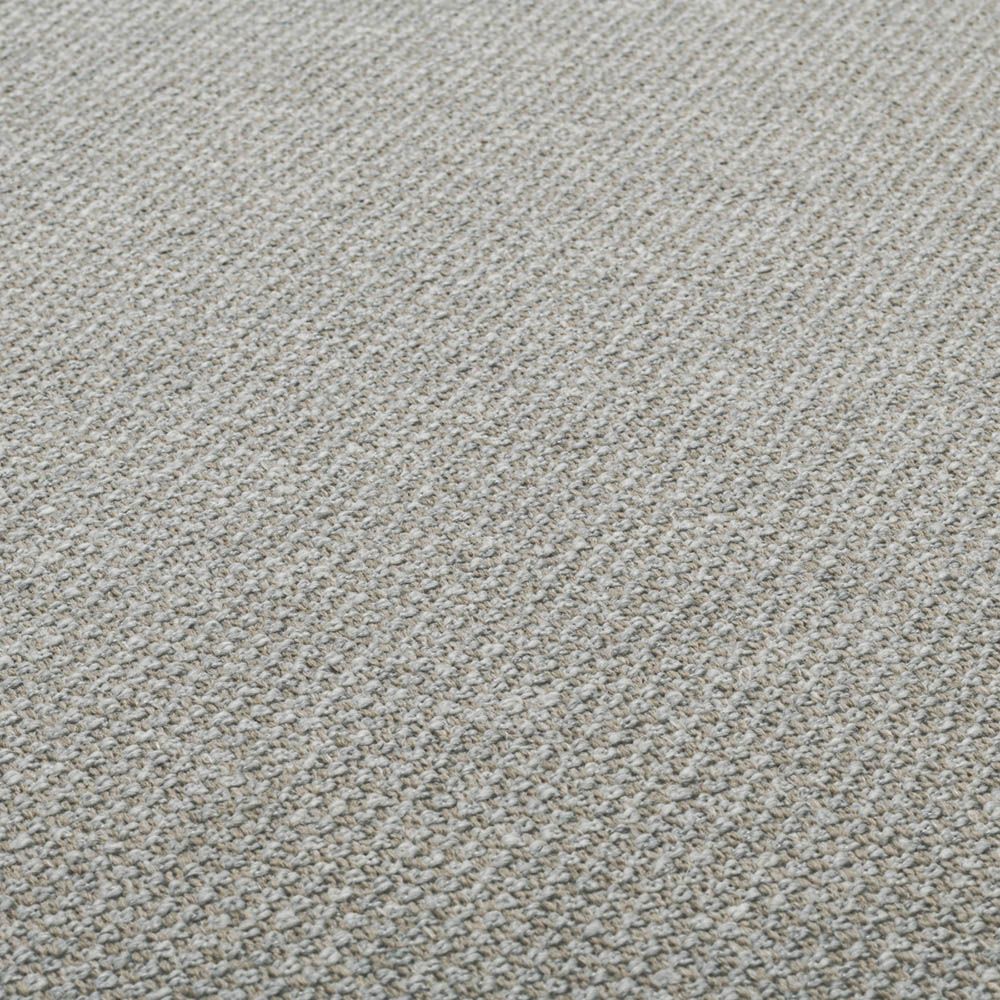 Stylish curved sofa upholstered in sleek grey upholstery