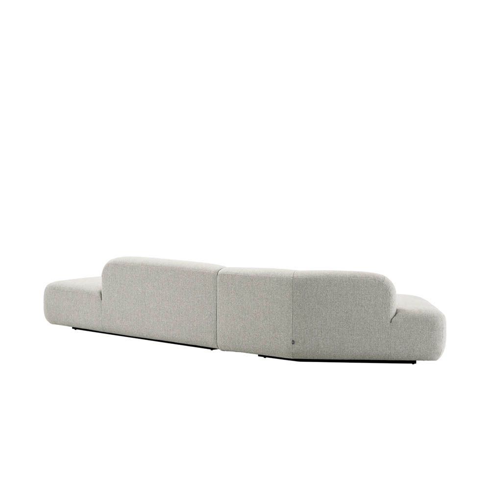 Stylish curved sofa upholstered in sleek grey upholstery