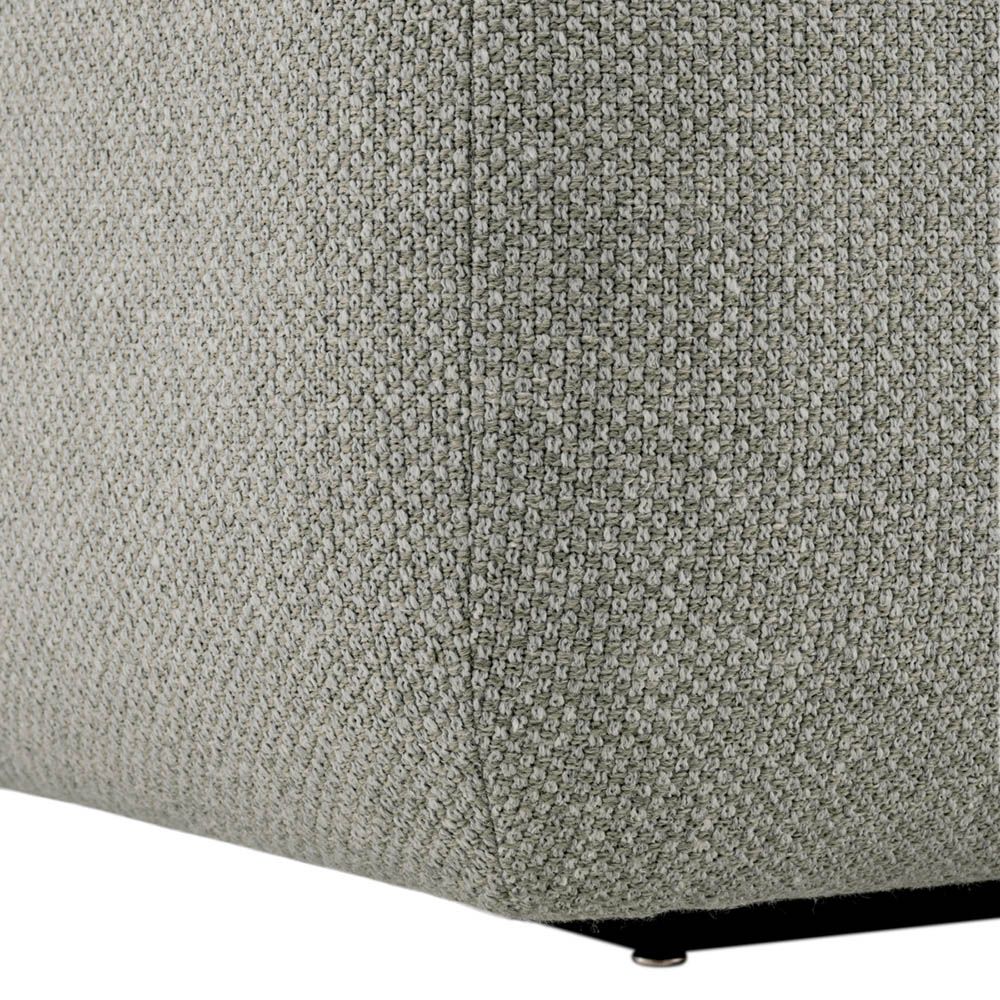 Stylish curved sofa upholstered in sleek grey upholstery