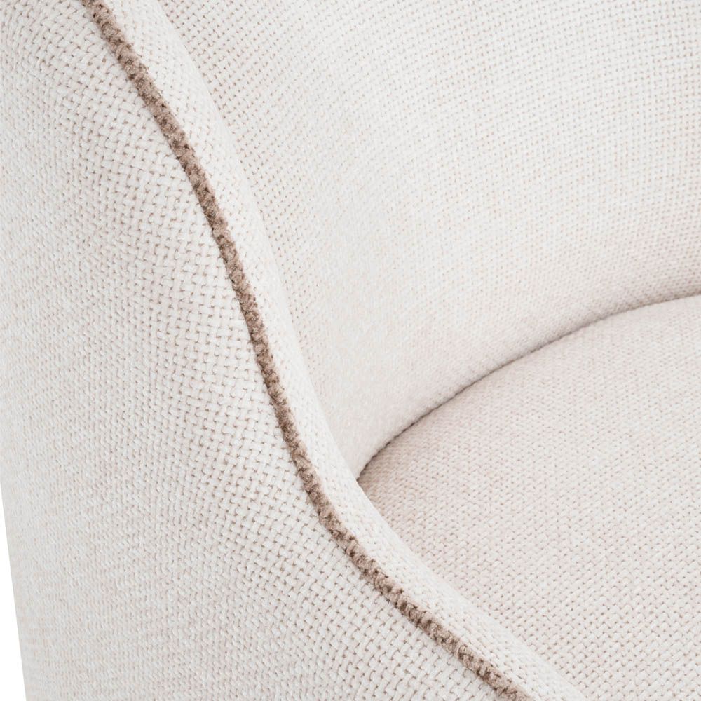 Elegant, sculptural chair with contrast piping detail