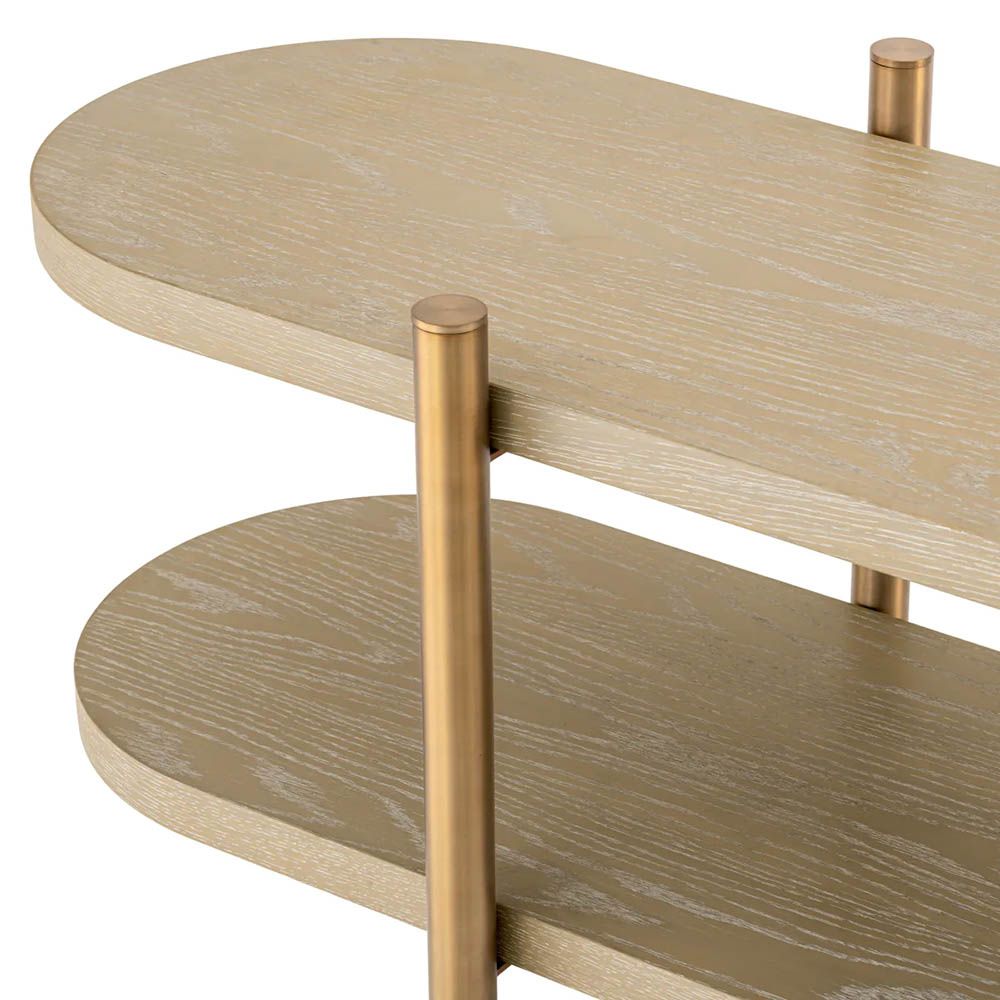 Curved and contemporary cabinet with washed oak shelves and brass legs