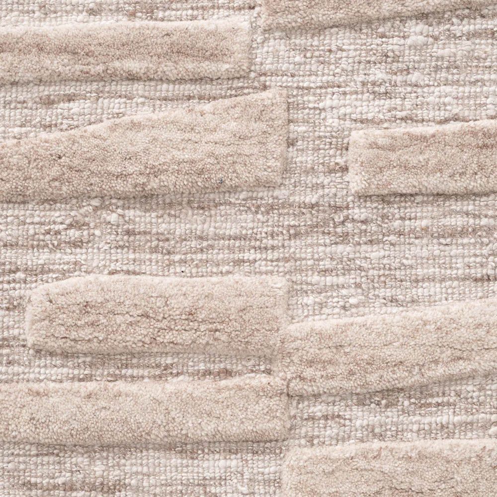 Wool beige rug with creamy textural accents