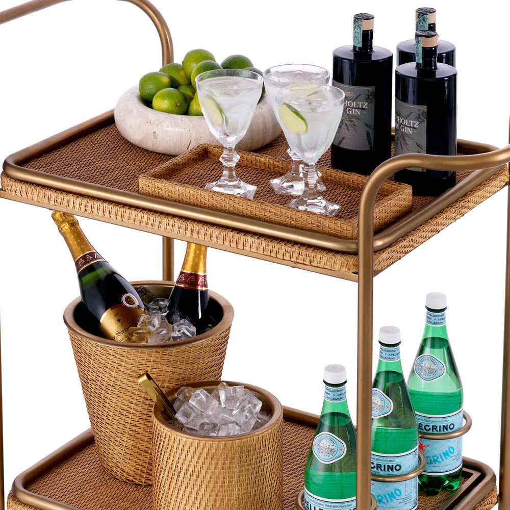 Chic trolley with vintage brass accents and natural rattan tiers