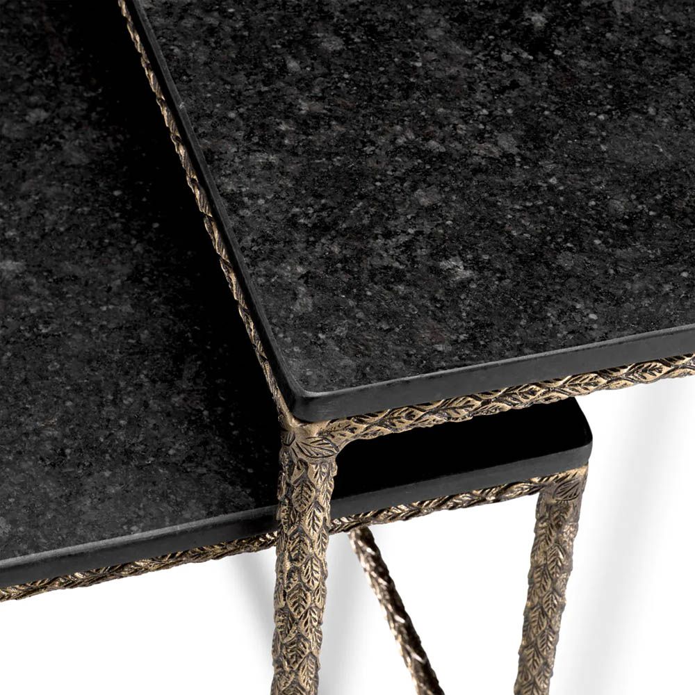 Set of two square-shaped black granite side tables with brass-finished base