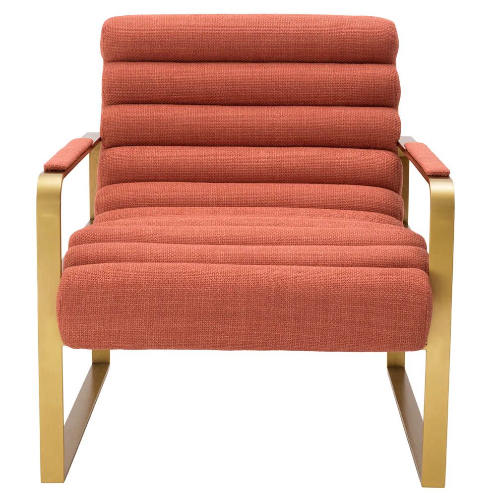 orange linen upholstered armchair with horizontal fluting and brass frame