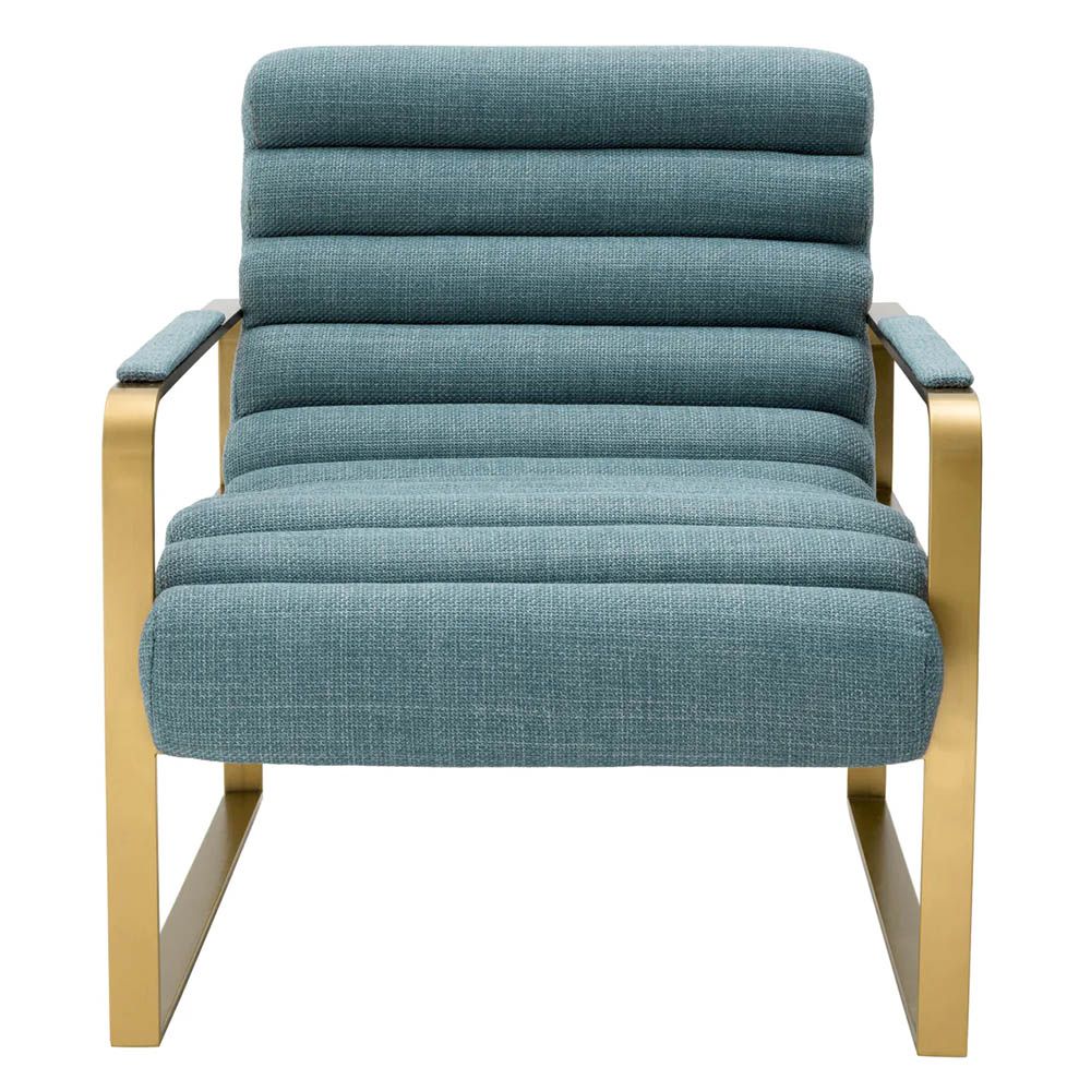 blue linen upholstered armchair with horizontal fluting and brass frame