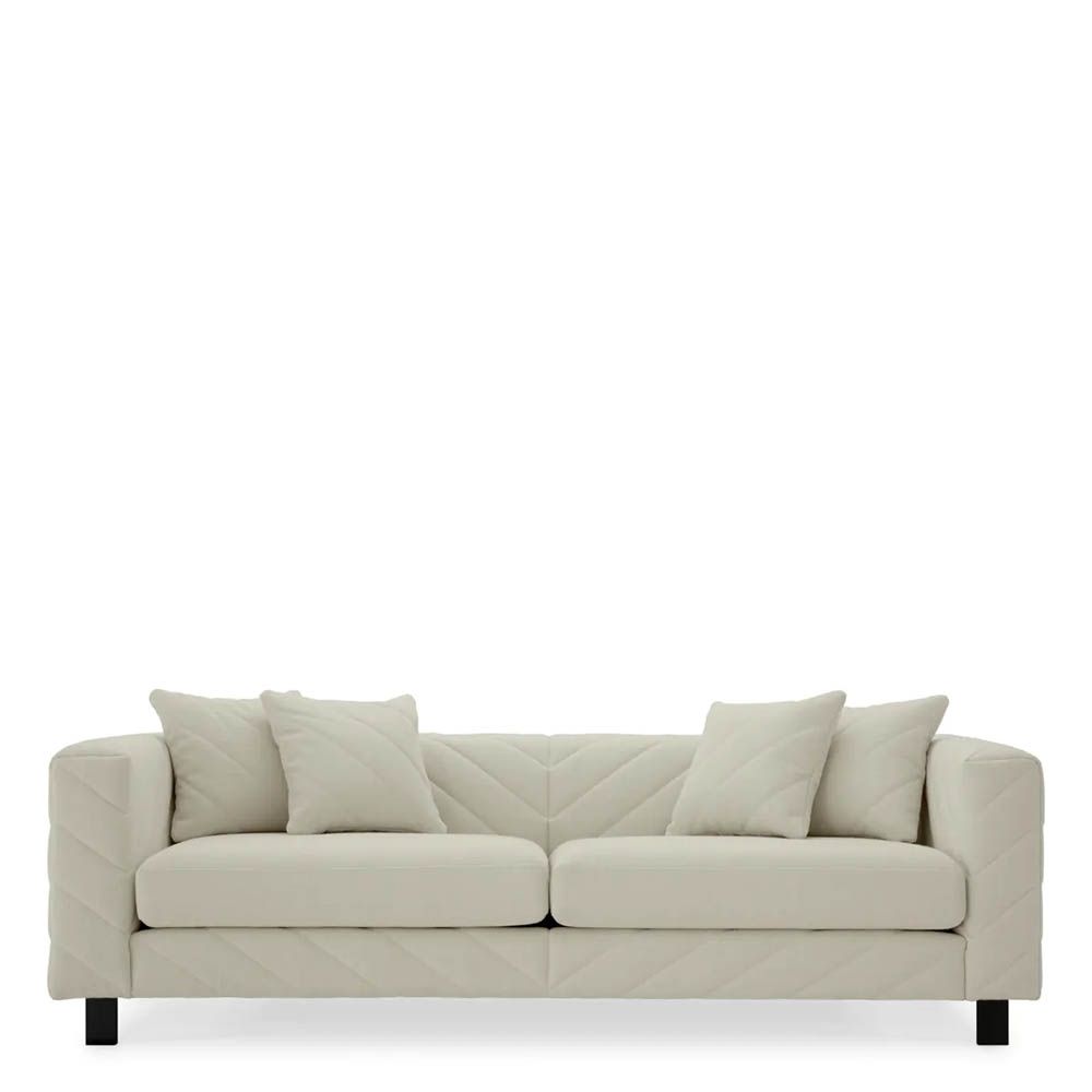 Upholstered modern sofa with chevron stitching detail