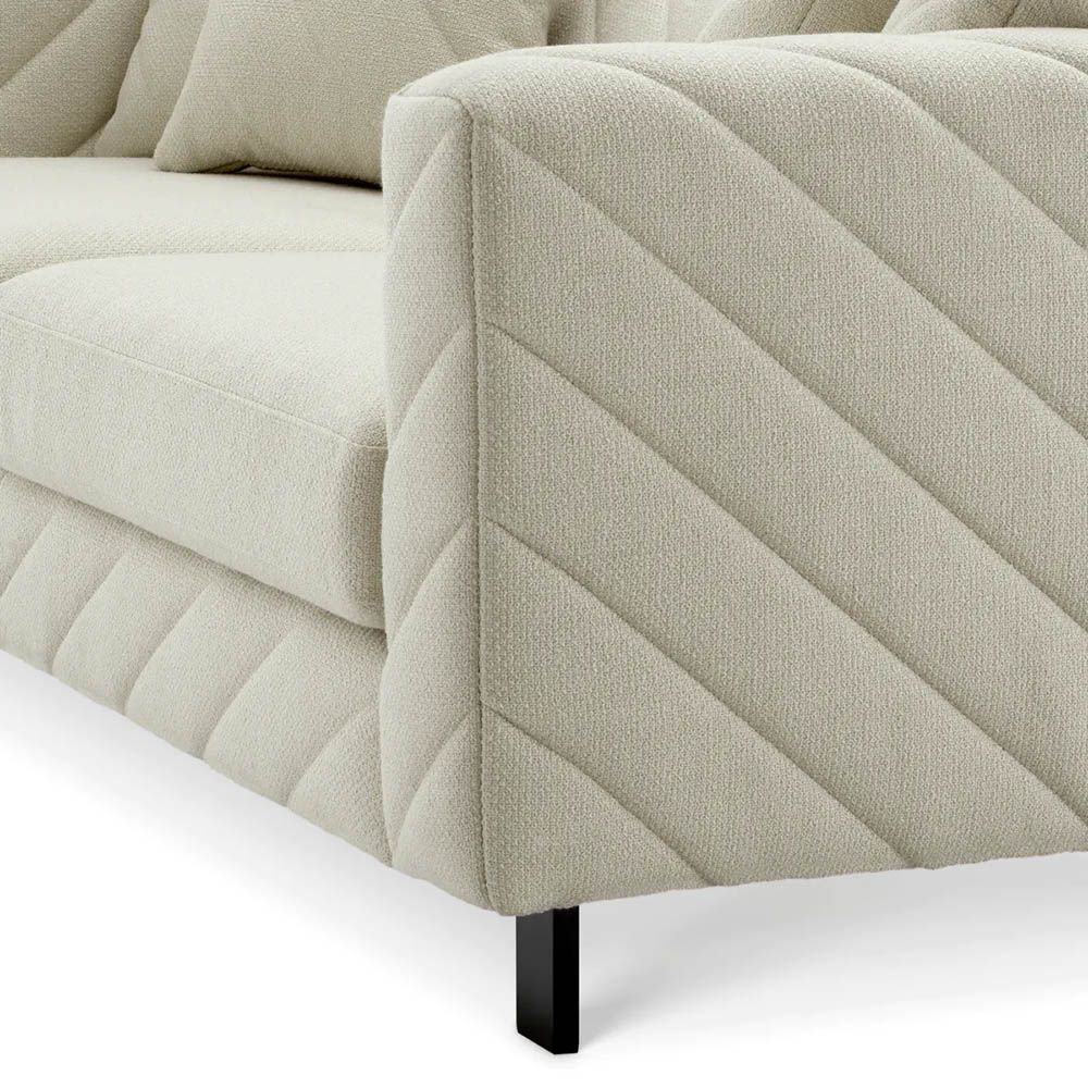 Upholstered modern sofa with chevron stitching detail