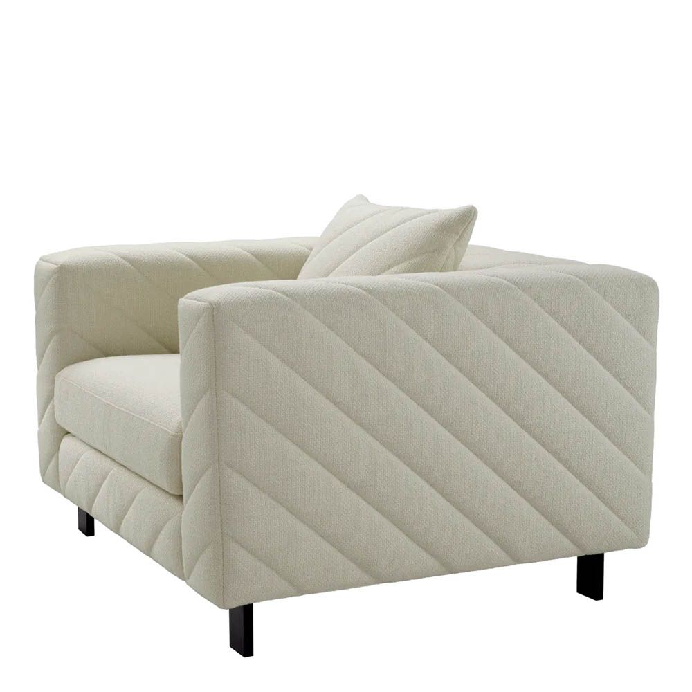 Upholstered modern armchair with chevron stitching detail in reve cream