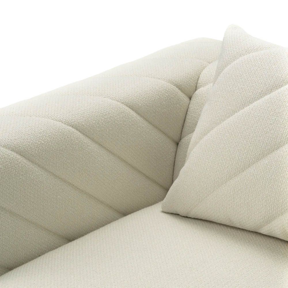 Upholstered modern armchair with chevron stitching detail in reve cream