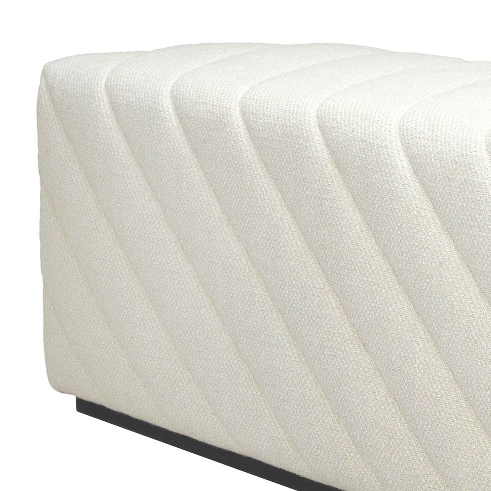 Cream upholstered modern bench with chevron stitching detail
