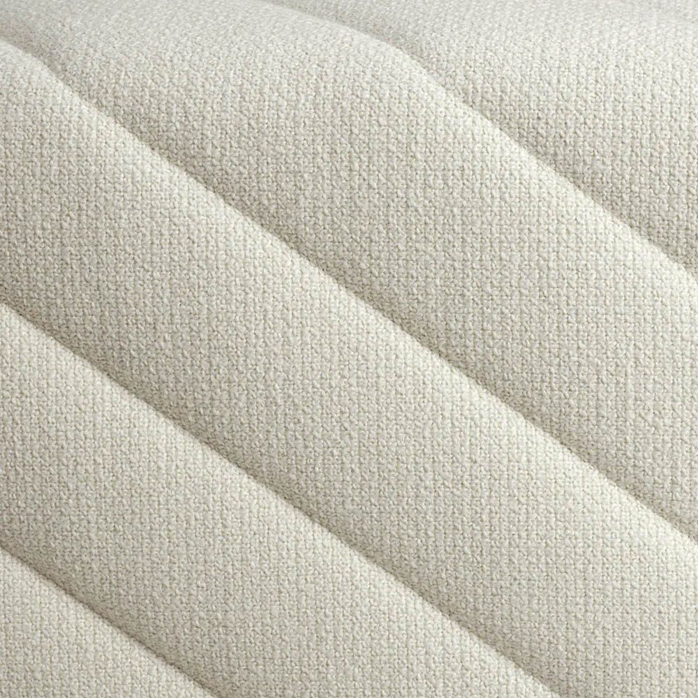 Cream upholstered modern bench with chevron stitching detail
