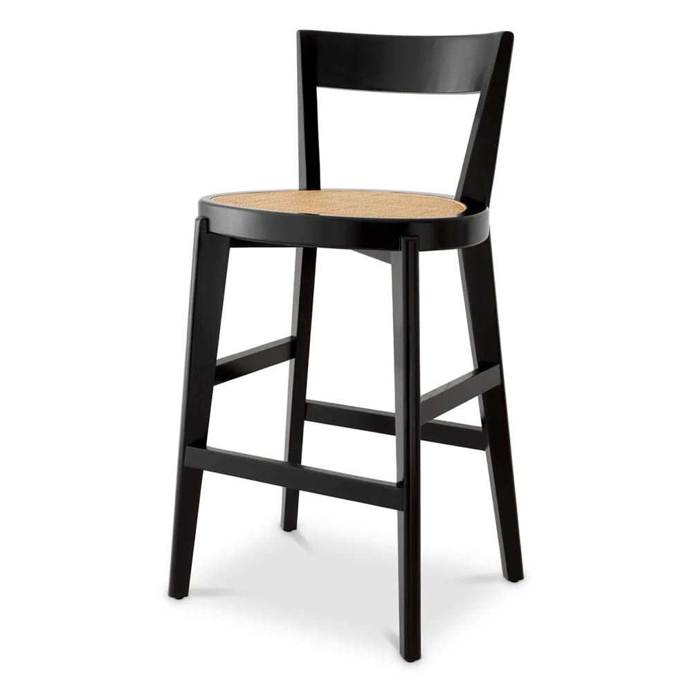 A stylish barstool by Eichholtz with a black composition and rattan seat