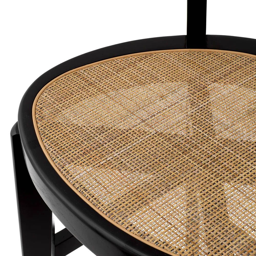 A stylish barstool by Eichholtz with a black composition and rattan seat