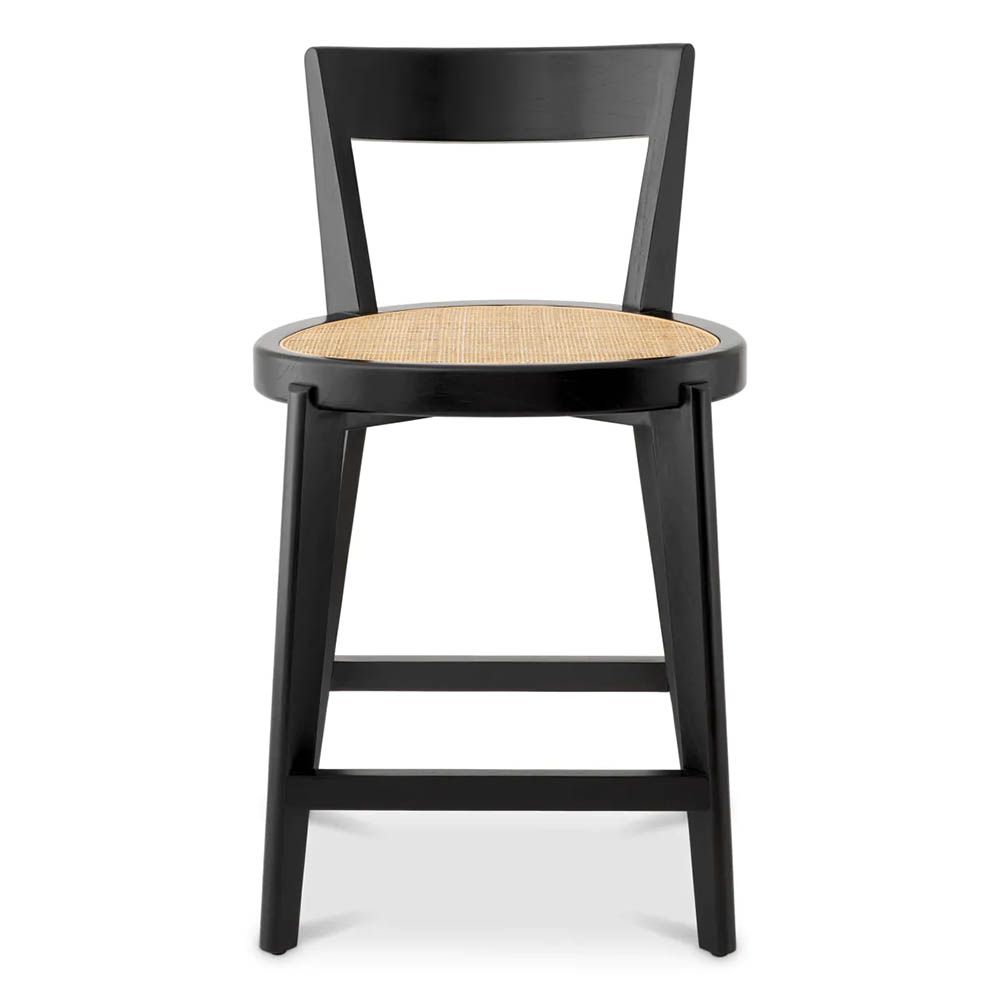 A stylish counter stool by Eichholtz with a black composition and rattan seat