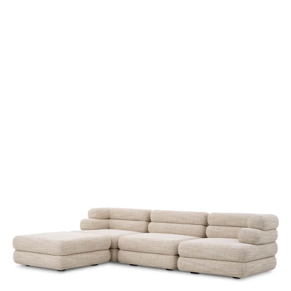 A contemporary modular sofa by Eichholtz with a sand coloured upholstery and modern design