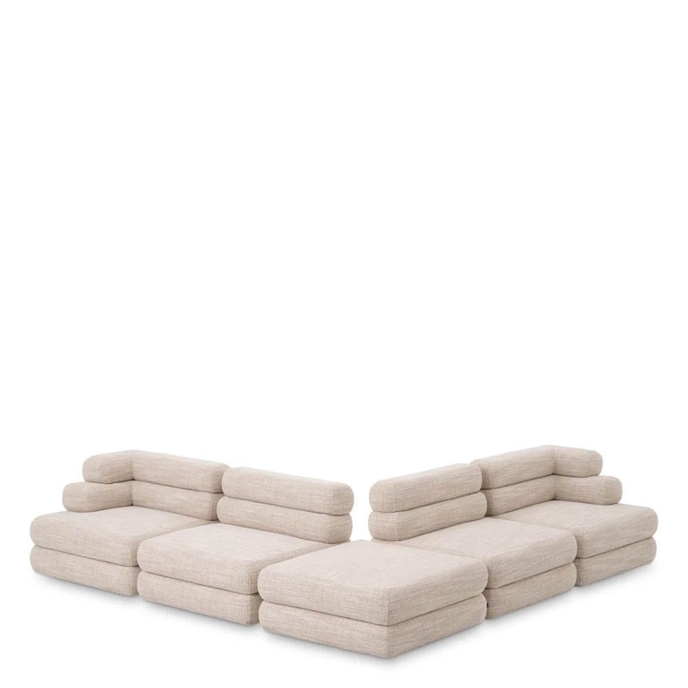 A contemporary modular sofa by Eichholtz with a sand coloured upholstery and modern design