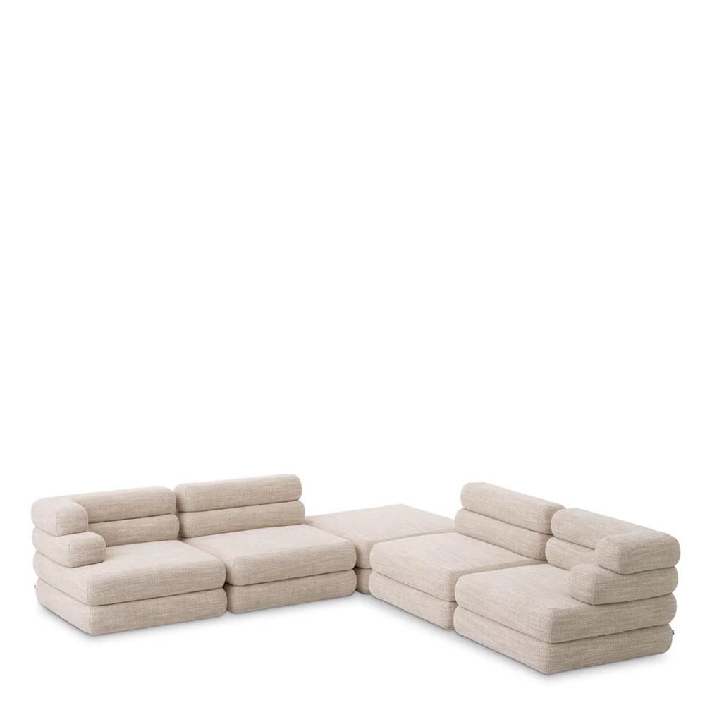 A contemporary modular sofa by Eichholtz with a sand coloured upholstery and modern design