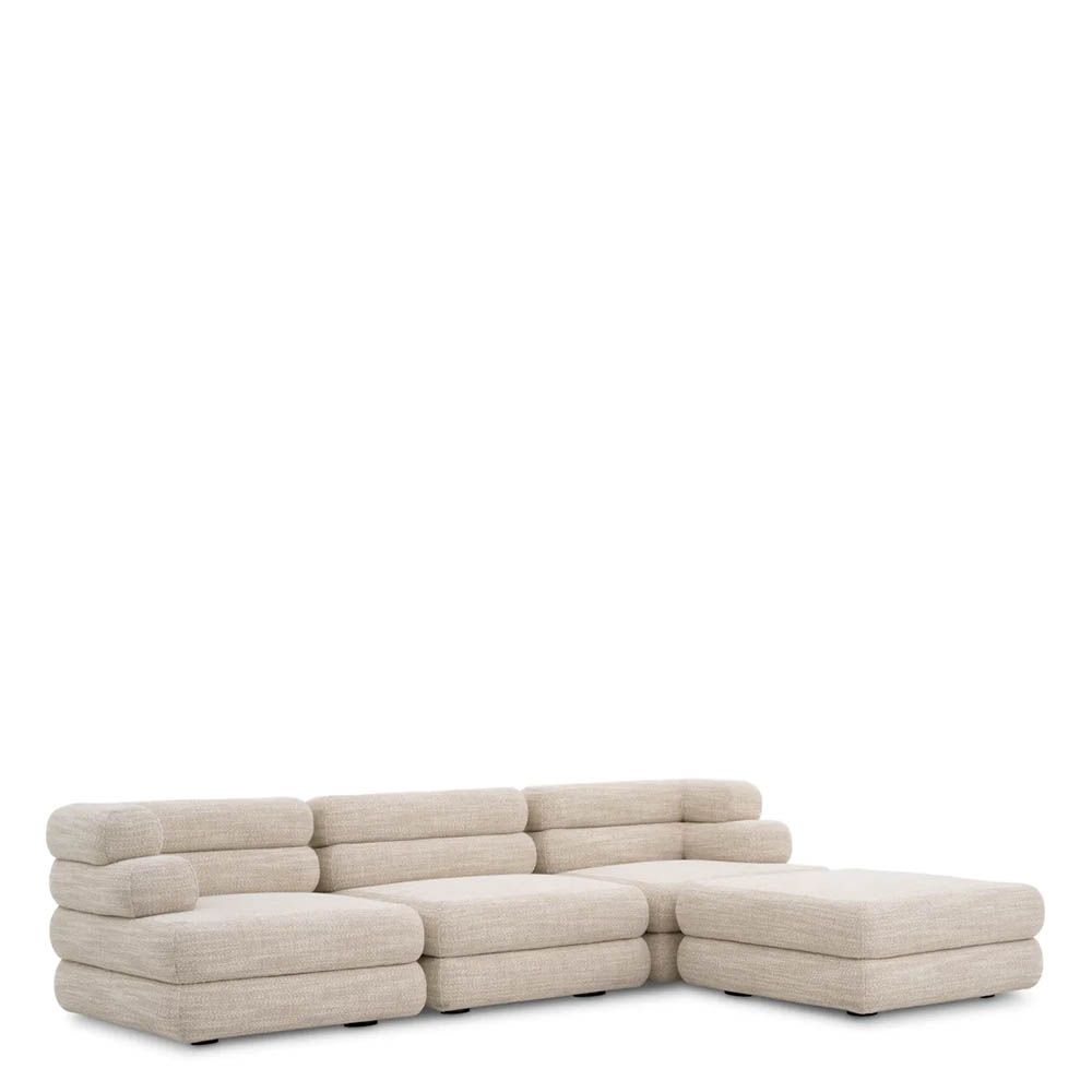 A contemporary modular sofa by Eichholtz with a sand coloured upholstery and modern design