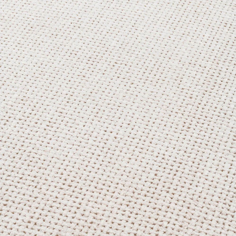 Round ottoman in lyssa off-white upholstery with wrap around legs
