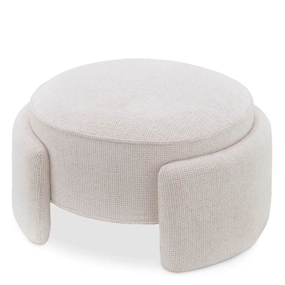 Round ottoman in lyssa off-white upholstery with wrap around legs