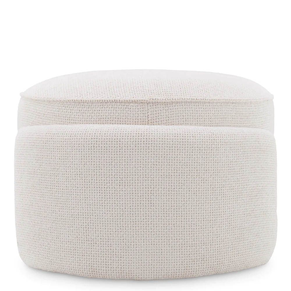 Round ottoman in lyssa off-white upholstery with wrap around legs