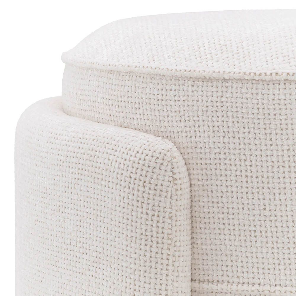 Round ottoman in lyssa off-white upholstery with wrap around legs