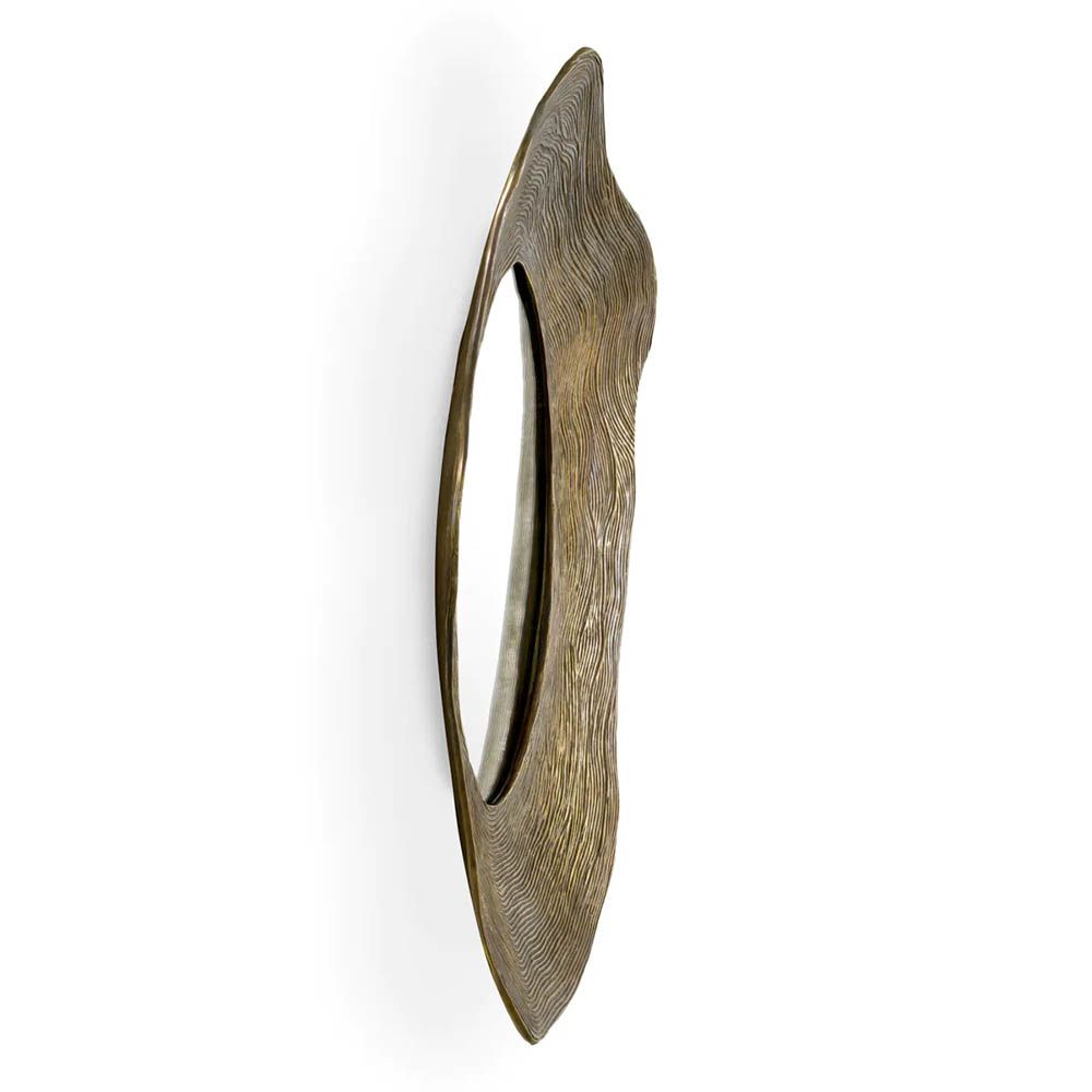 Mirror with vintage brass frame in rounded abstract design
