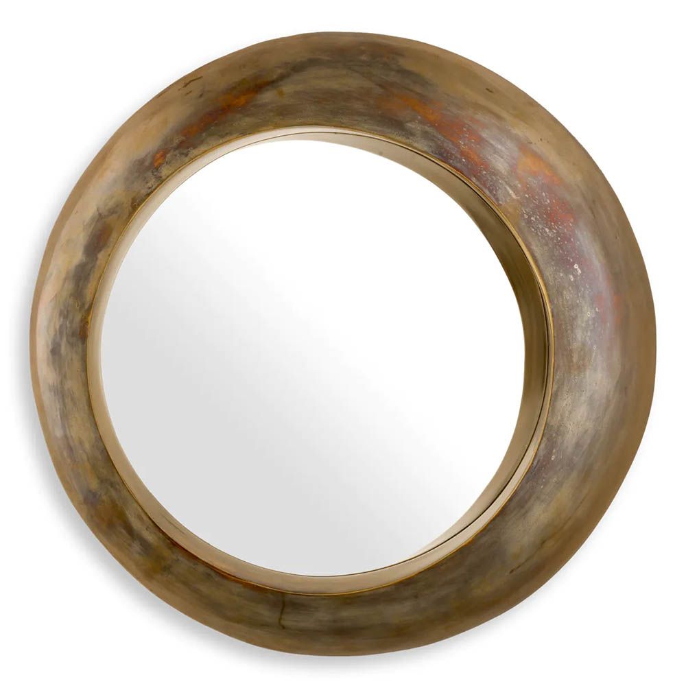 Vintage brass round mirror boasting sleek circular form