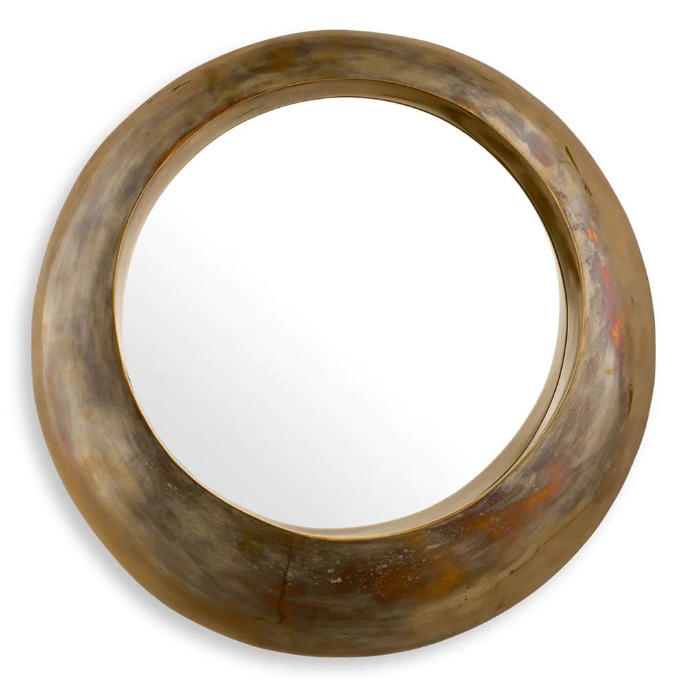 Vintage brass round mirror boasting sleek circular form