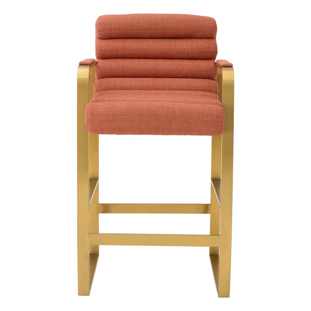 orange linen upholstered counter stool with horizontal fluting and brass frame