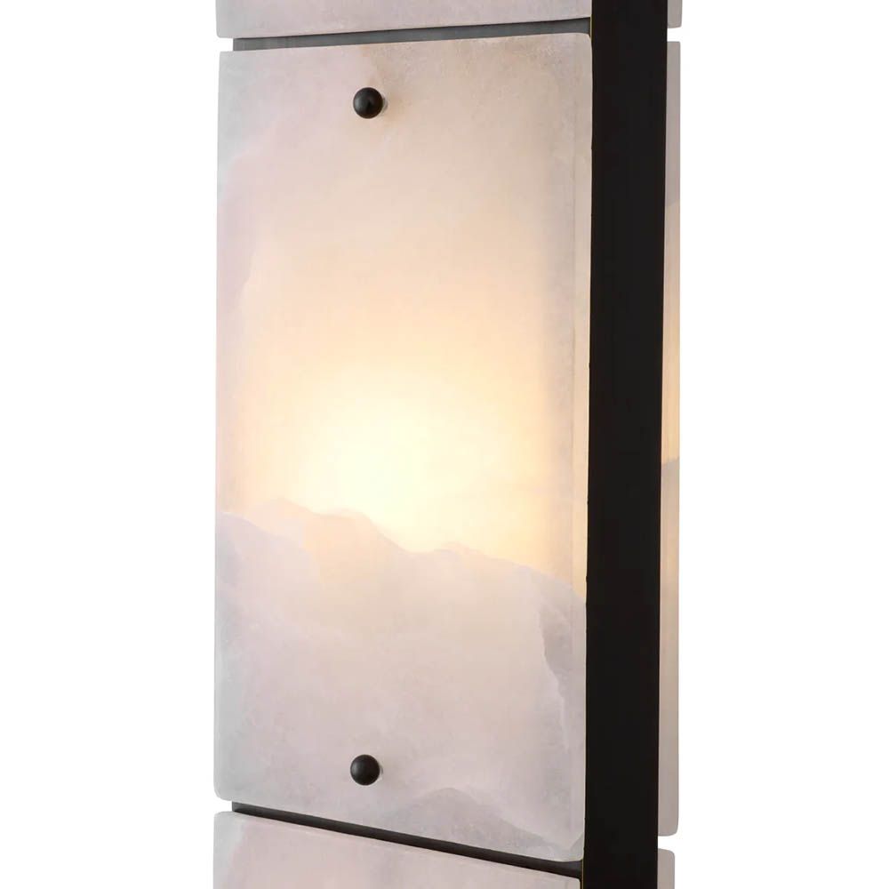 alabaster and bronze finish, with light warmly diffusing through the base for an inviting glow