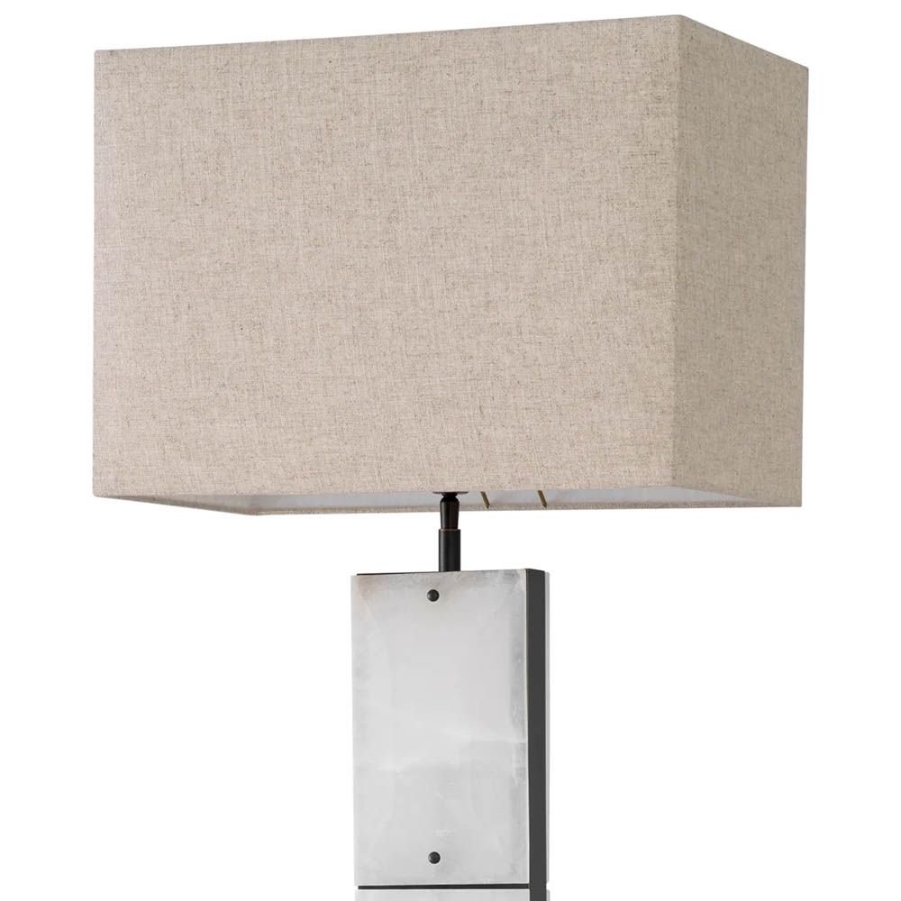 alabaster and bronze finish, with light warmly diffusing through the base for an inviting glow