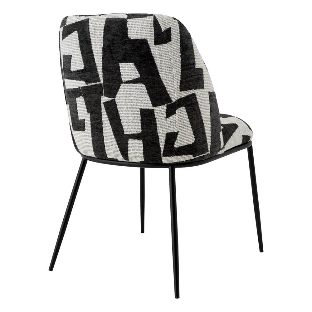 Dining chair with black and white abstract design and black legs