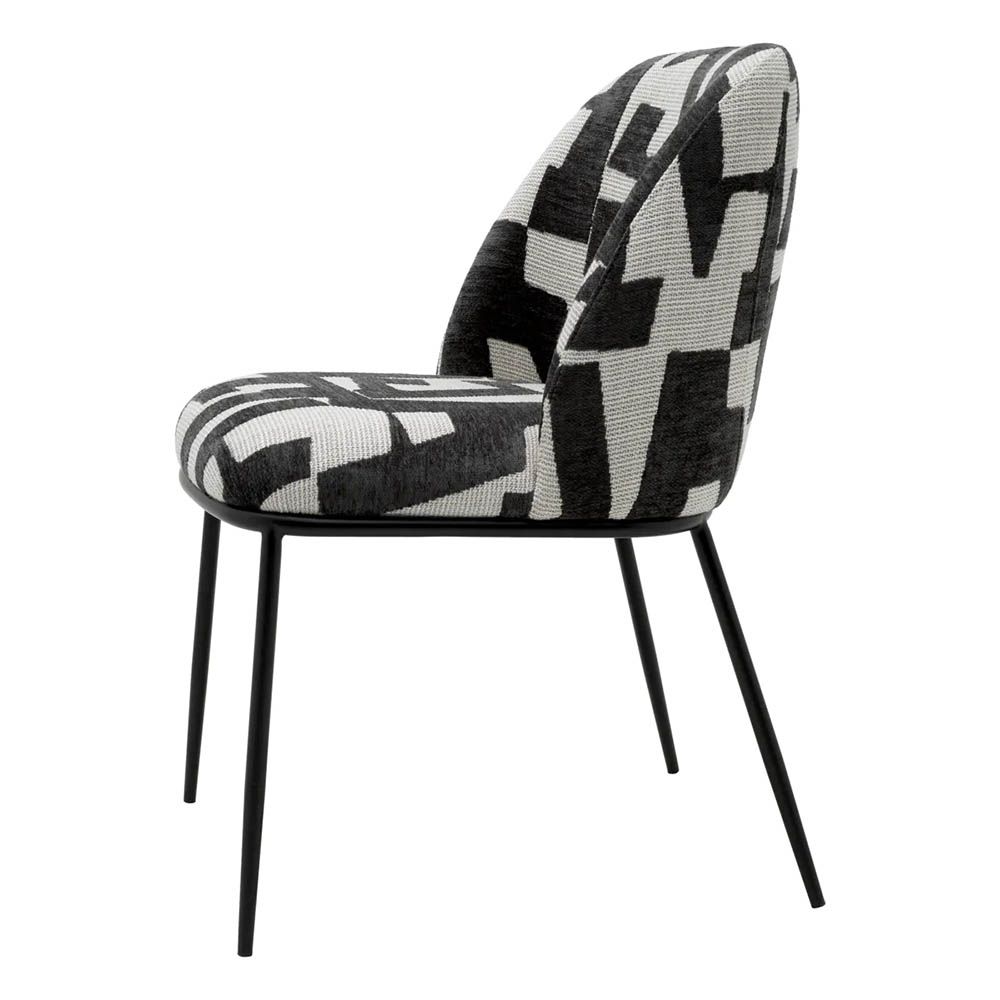 Dining chair with black and white abstract design and black legs