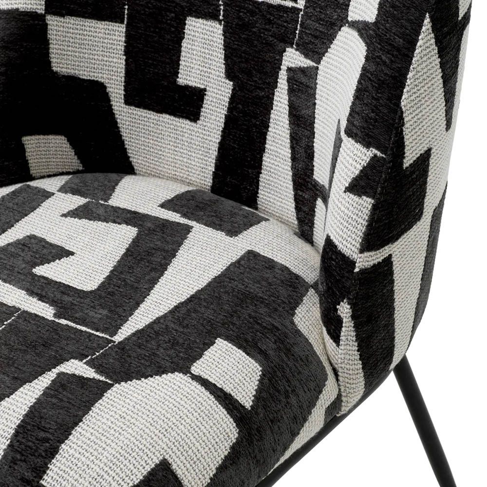 Dining chair with black and white abstract design and black legs
