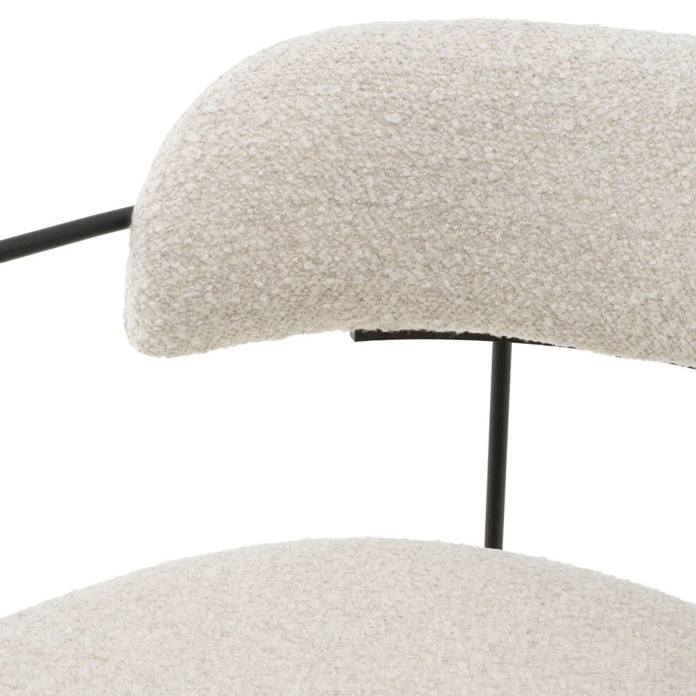 Dining chair with black frame and cream boucle seat and back pads