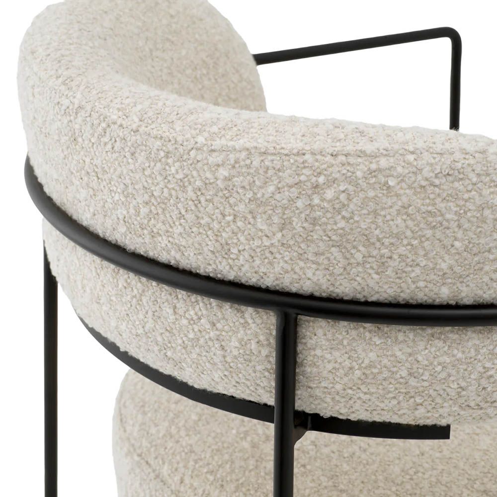 Dining chair with black frame and cream boucle seat and back pads
