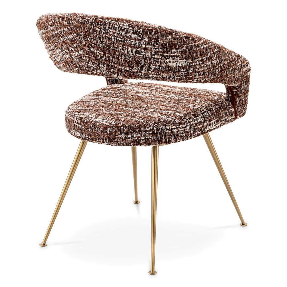 A stylish dining chair by Eichholtz with an open back and statement upholstery