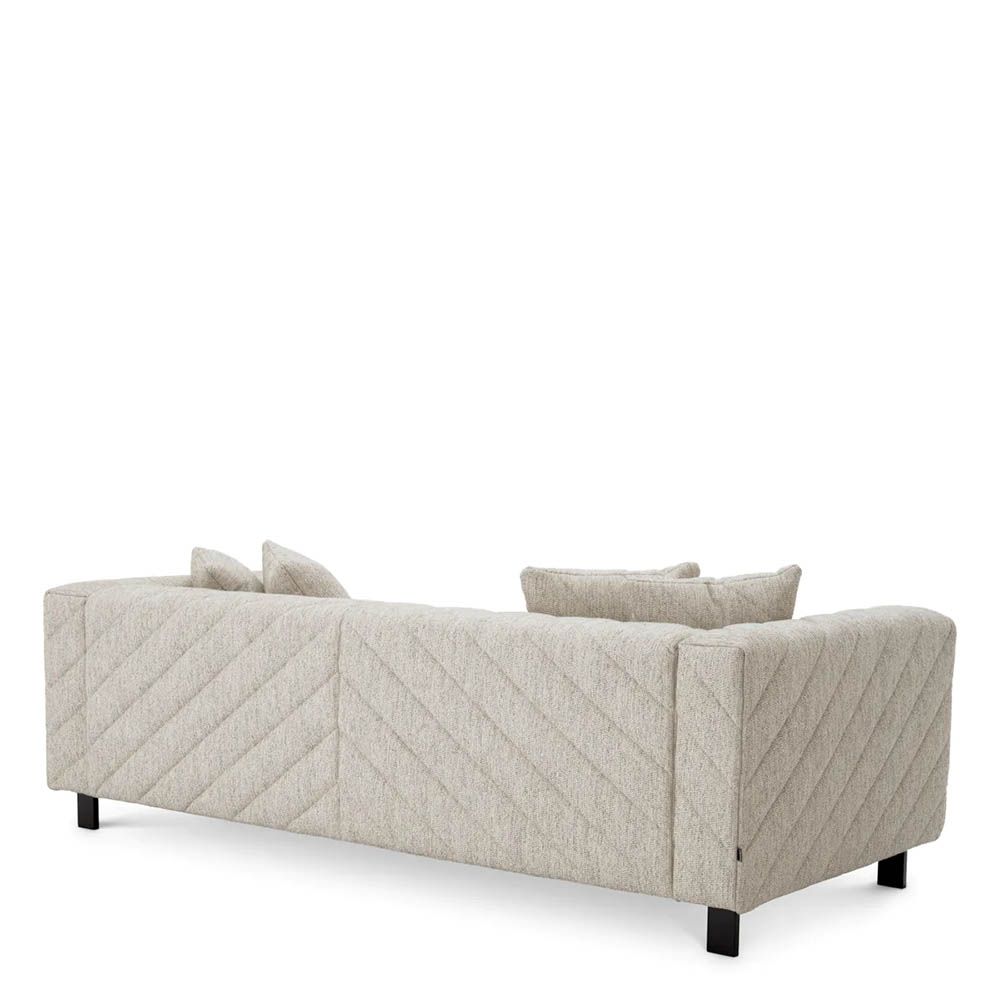 Sumptuous grey upholstered modern sofa with chevron stitching detail