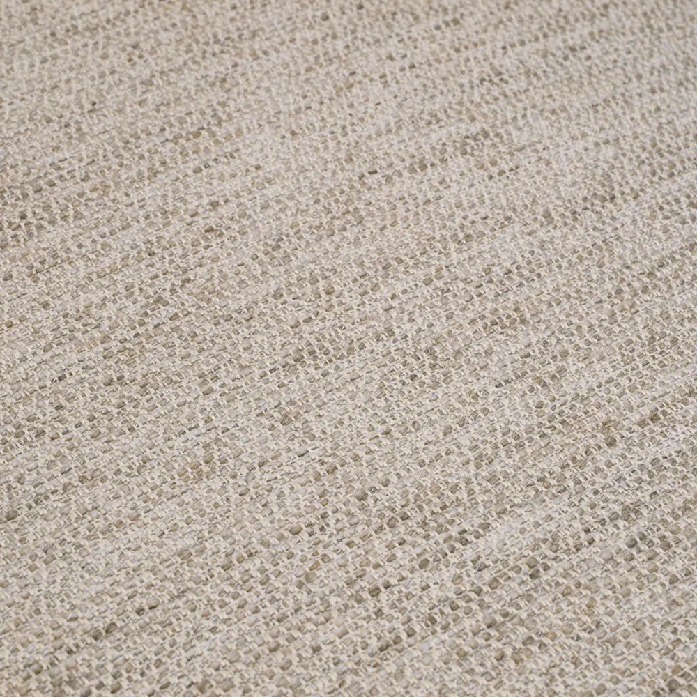 Grey upholstered modern armchair with chevron stitching detail