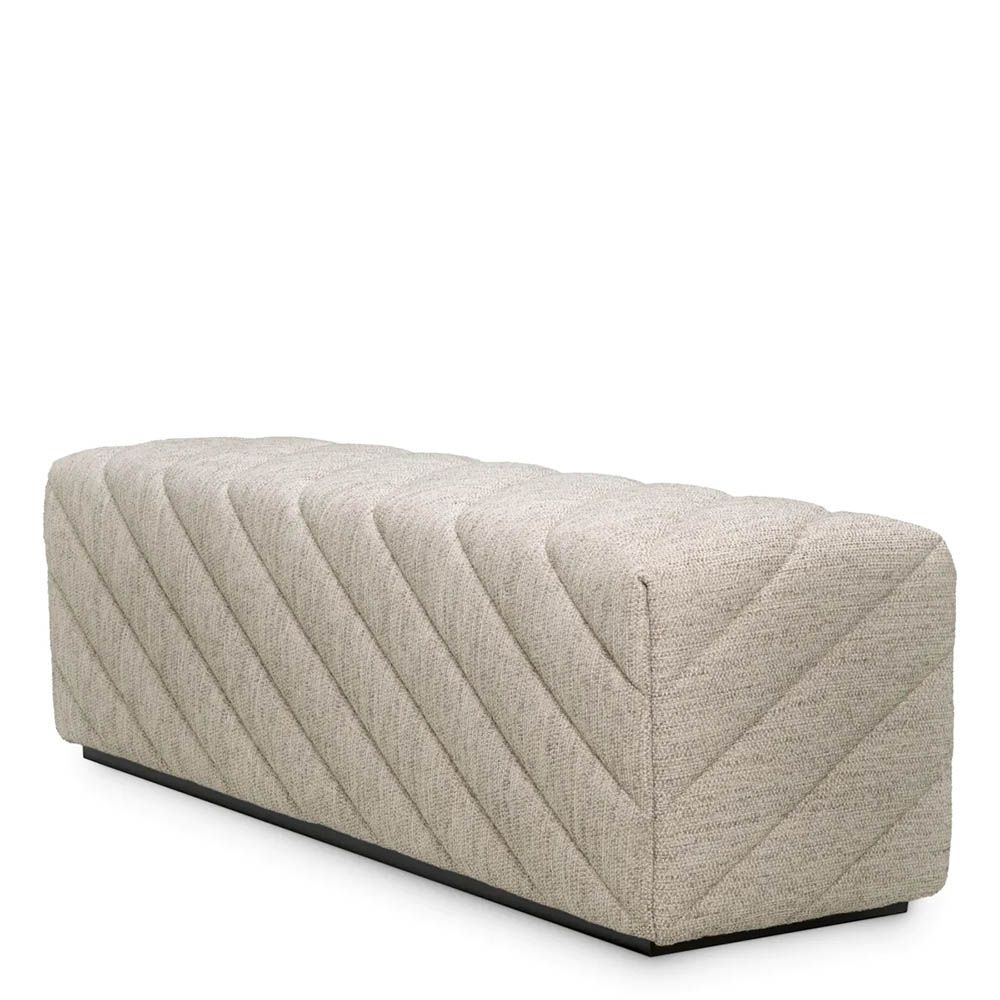 Grey upholstered modern sofa with chevron stitching detail