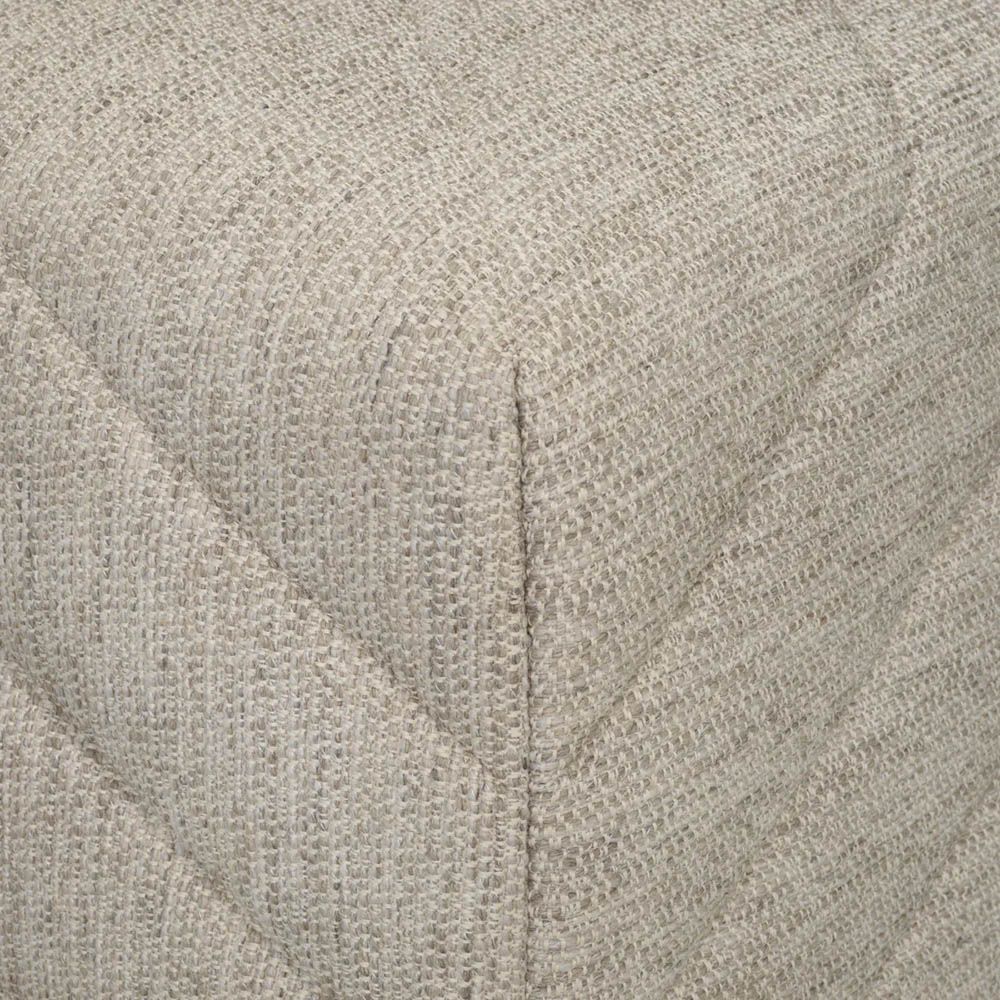 Grey upholstered square stool with chevron stitching detail 