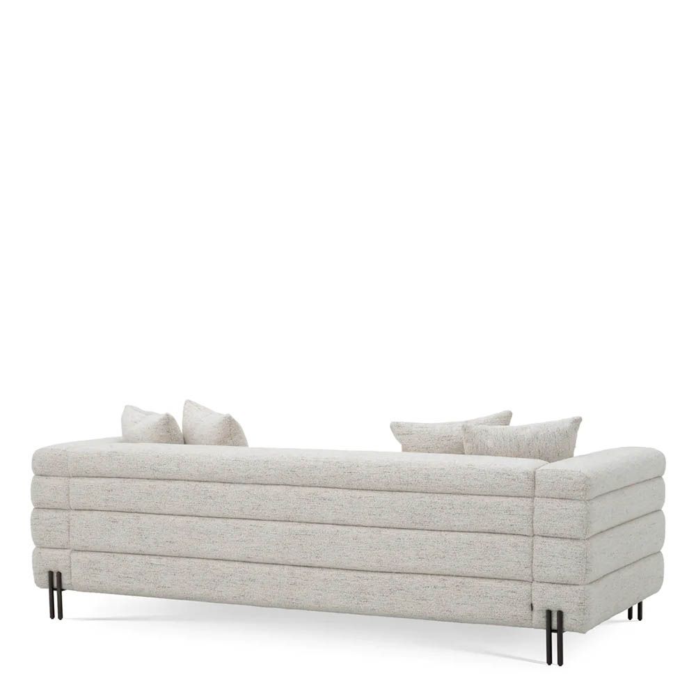 Off-white upholstered sofa with horizontal fluting